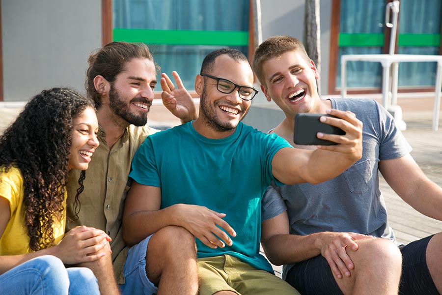 Employee Benefits - Group of Coworkers Laughing and Taking a Break Outside, Taking a Selfie Together