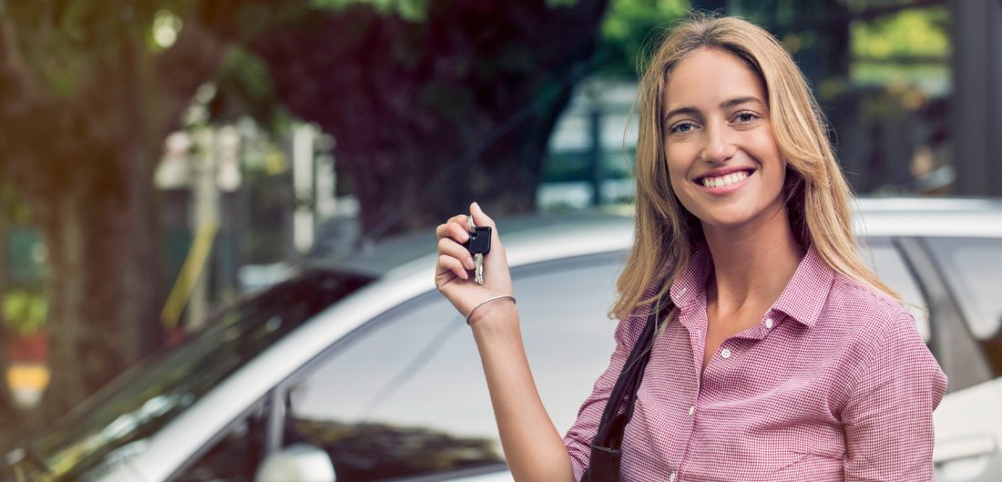 a lady holding car keys