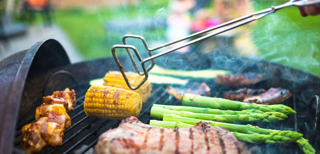 vegetables and meat cooks on grill